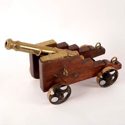 Lot 324 - A tabletop model of a brass cannon with...