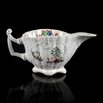 Lot 868 - A Worcester fluted creamboat, circa 1752-53,...