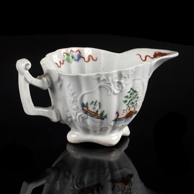 Lot 868 - A Worcester fluted creamboat, circa 1752-53,...