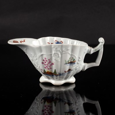 Lot 868 - A Worcester fluted creamboat, circa 1752-53,...