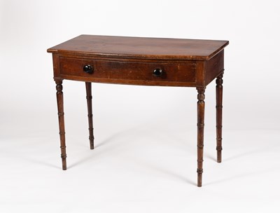 Lot 6 - A George IV bowfront side table fitted a...