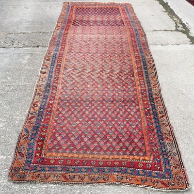 Lot 68 - An Afghan runner with central fields of...