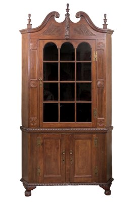Lot 556 - An American cherrywood standing corner...