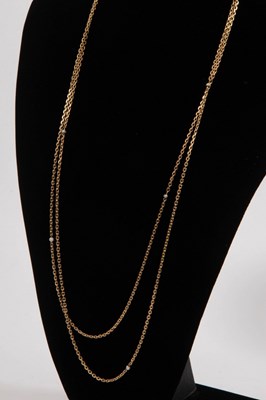 Lot 6 - A gold guard chain, tests as 18ct gold,...