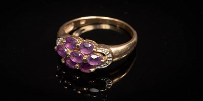 Lot 12 - A 9ct yellow gold and amethyst bracelet, set...