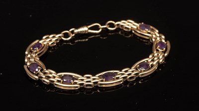 Lot 12 - A 9ct yellow gold and amethyst bracelet, set...