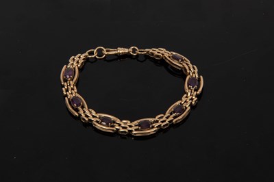 Lot 12 - A 9ct yellow gold and amethyst bracelet, set...