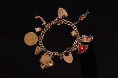 Lot 31 - A charm bracelet, the 9ct curb-link bracelet...