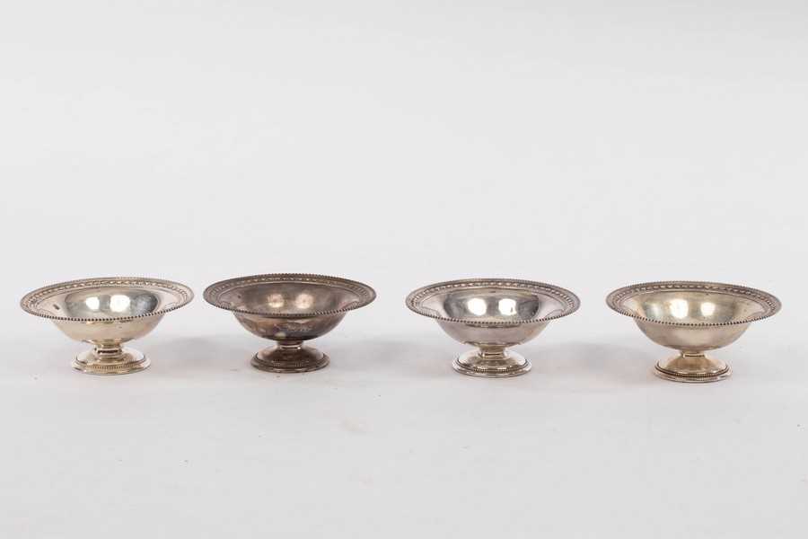 Lot 104 - A set of four Edwardian silver bonbon dishes,...