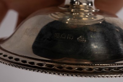 Lot 104 - A set of four Edwardian silver bonbon dishes,...