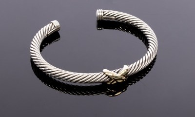 Lot 41 - David Yurman, a silver and gold cable bangle,...