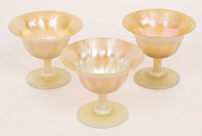 Lot 116 - Tiffany, three Favrile footed bowls, with...