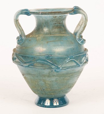 Lot 118 - A twin-handled blue glass vase of amphora...
