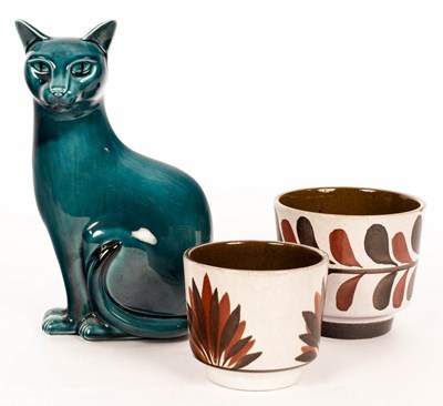 Lot 127 - Poole Pottery, a model of a seated cat, teal...