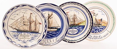 Lot 147 - Poole Pottery, four plates painted with...