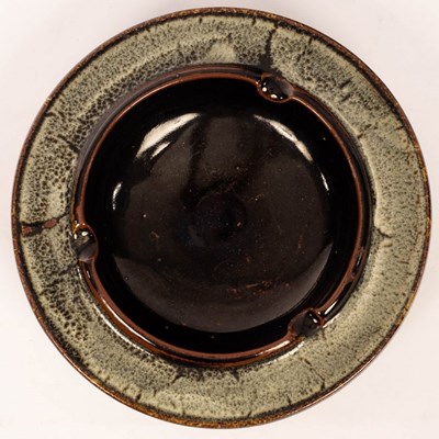 Lot 214 - A circular dish, tenmoku glaze with speckled...