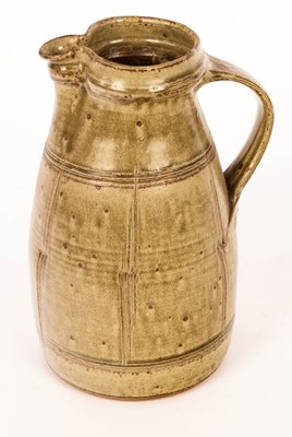 Lot 226 - A studio pottery jug, ash glaze, impressed...