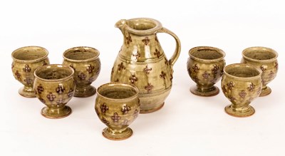 Lot 227 - A studio pottery jug, ash glaze with iron dot...