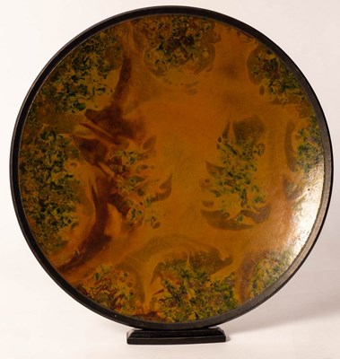 Lot 252 - Andrew Hill, a raku glazed charger, incised...