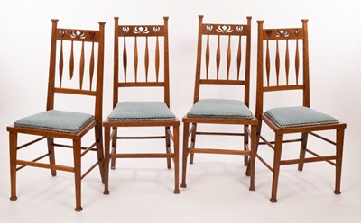 Lot 546 - A set of four Art Nouveau oak dining chairs,...