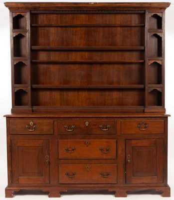 Lot 755 - A 19th Century oak dresser, the closed rack...
