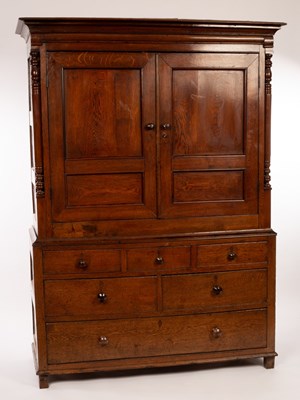 Lot 762 - A George III oak and yew wood press cupboard,...