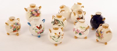 Lot 25 - Eight Royal Worcester spherical cauldron vases,...