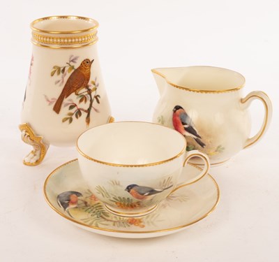 Lot 30 - A Royal Worcester tapering vase on three lion...