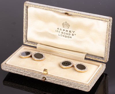 Lot 180 - A pair onyx and diamond cufflinks, set in 18ct...