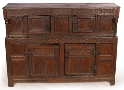 Lot 883 - An English oak press cupboard, the overhanging...