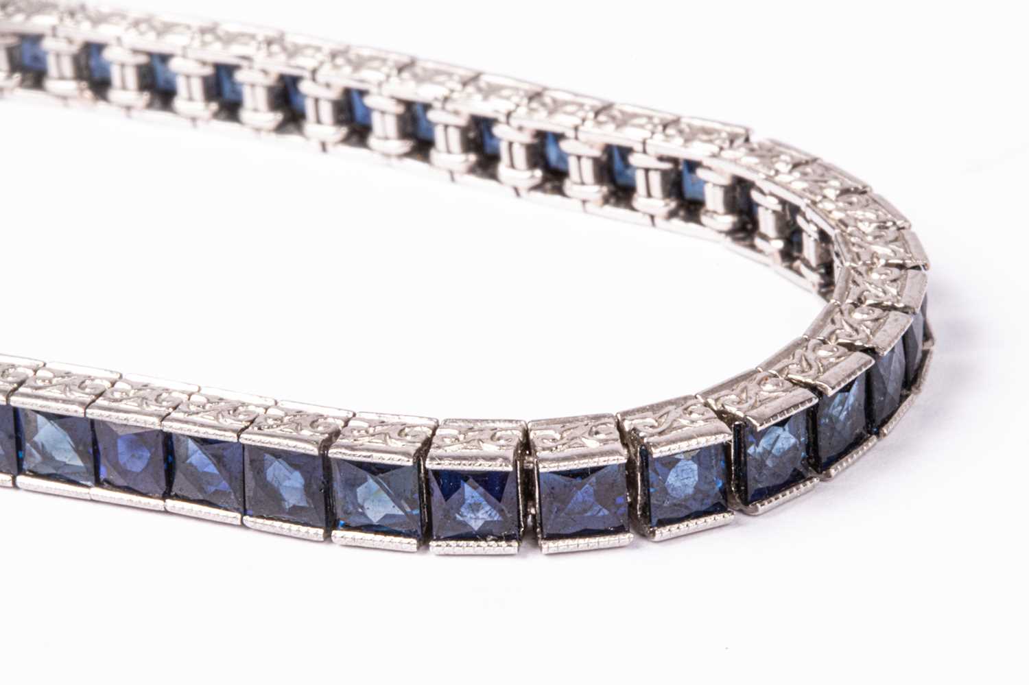 Lot 46 - A platinum and sapphire line bracelet