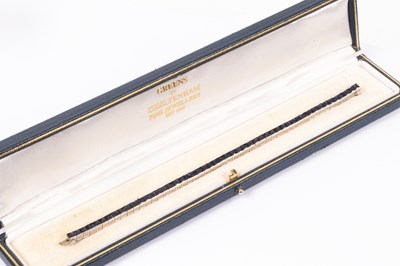 Lot 46 - A platinum and sapphire line bracelet