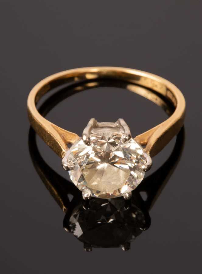 Lot 5 - A diamond solitaire ring, the claw set stone...