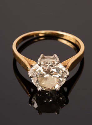 Lot 5 - A diamond solitaire ring, the claw set stone...