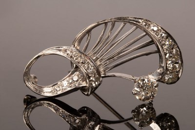 Lot 17 - A diamond brooch of stylised form, the...