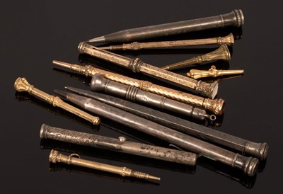 Lot 100 - A silver mounted propelling pencil and nine...