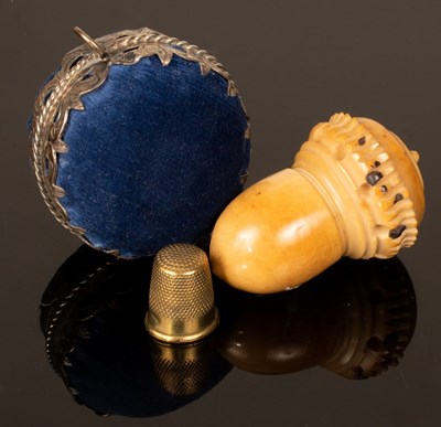Lot 350 - An acorn-shaped thimble box and a pierced and...
