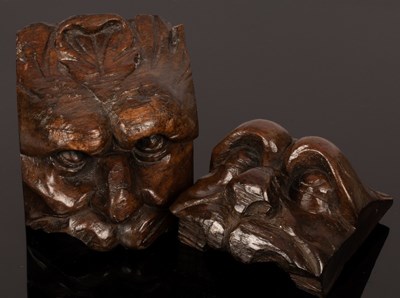 Lot 485 - A pair of 18th Century carved mask head mounts,...