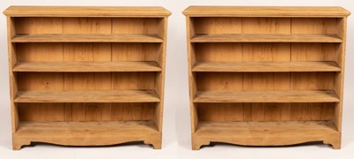 Lot 776 - A near pair of oak open bookcases, 125cm and...
