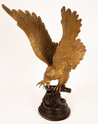 Lot 1004 - A brass sculpture of an eagle, on a bronze...