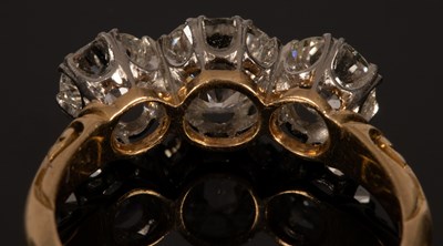 Lot 4 - A diamond three-stone ring, the central stone...