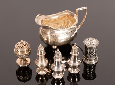 Lot 49 - A silver cream jug, Birmingham 1923, of oblong...
