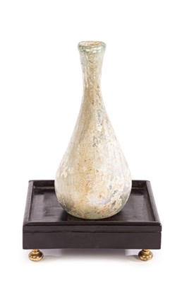 Lot 2 - A Roman glass flask, 2nd -3rd Century AD, in...