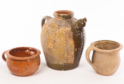 Lot 22 - Two early pottery chamber pots, one 16th...