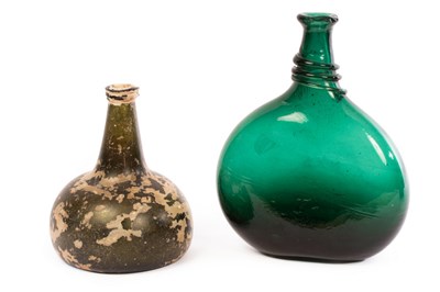 Lot 28 - An 'onion' wine bottle, early 18th Century,...