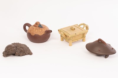 Lot 96 - A Chinese Yixing teapot and cover in the form...
