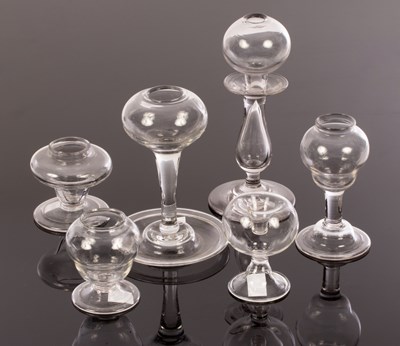 Lot 321 - Six lacemaker's lamps, the tallest 20cm high