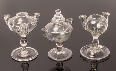 Lot 324 - Three lacemaker's lamps, two with three...