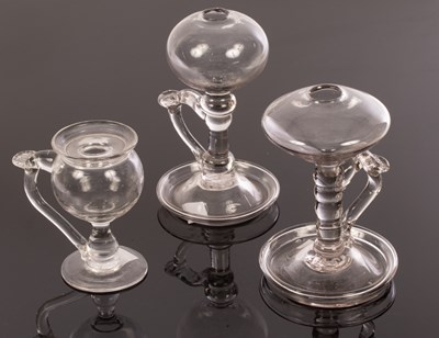 Lot 325 - Three lacemaker's lamps, each with well and...