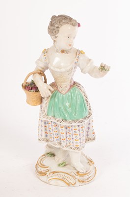Lot 345 - A Meissen figure of a girl with a flower...